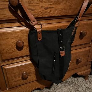 Canvas, backpacks in 2 colors. Black and brown. New with no tags. $8 each.